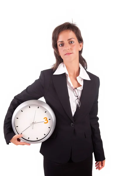 Affärskvinna som innehar en klocka — Stockfoto