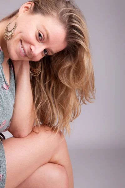 stock image Beautiful woman sitting on a chair