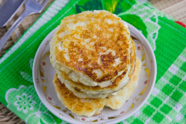 Fried curd pancakes on a dish — Stock Photo, Image