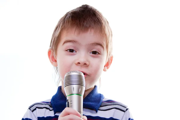 Malý chlapec s mikrofonem v ruce — Stock fotografie