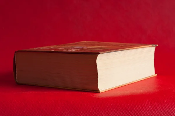 Book on a bright red background — Stock Photo, Image