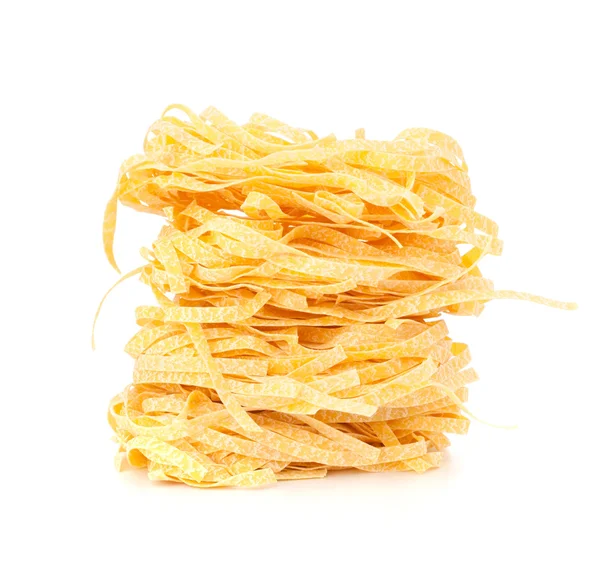 stock image Italian pasta tagliatelle nest isolated on white background