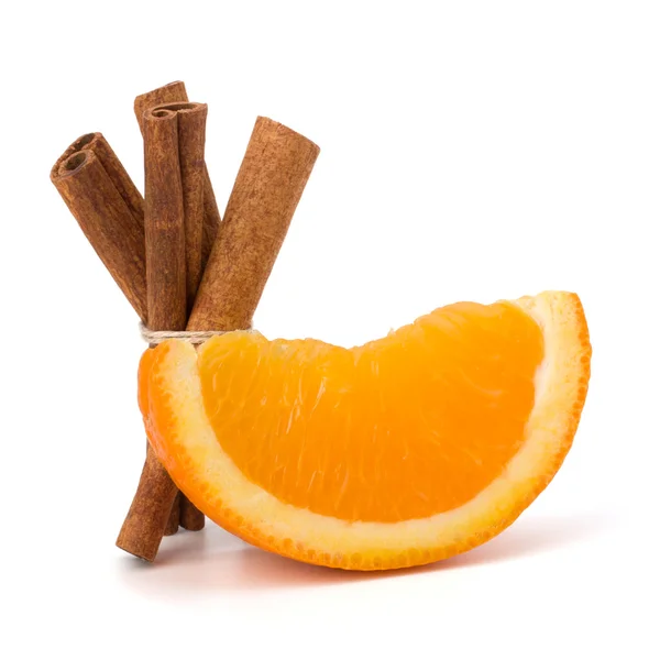 stock image Orange fruit segment and cinnamon sticks isolated on white back