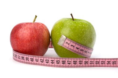 Apple with tape measure. Healthy lifestyle concept. clipart