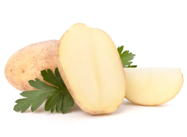 Potato tubers and parsley leaves — Stock Photo, Image