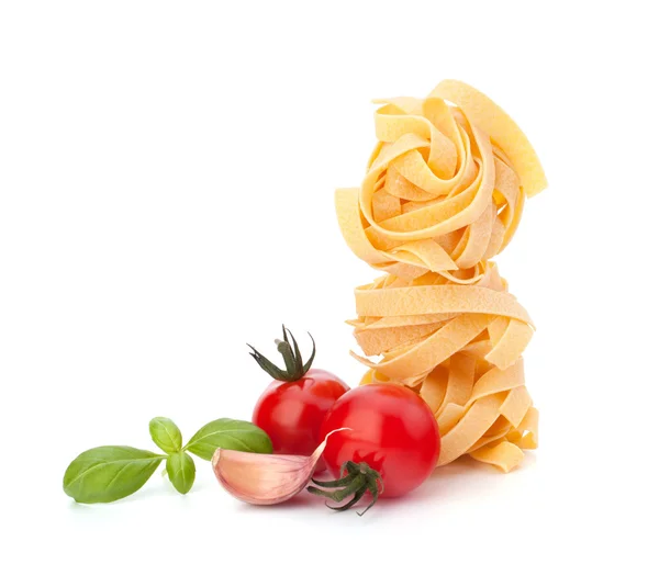 stock image Italian pasta fettuccine nest and cherry tomato