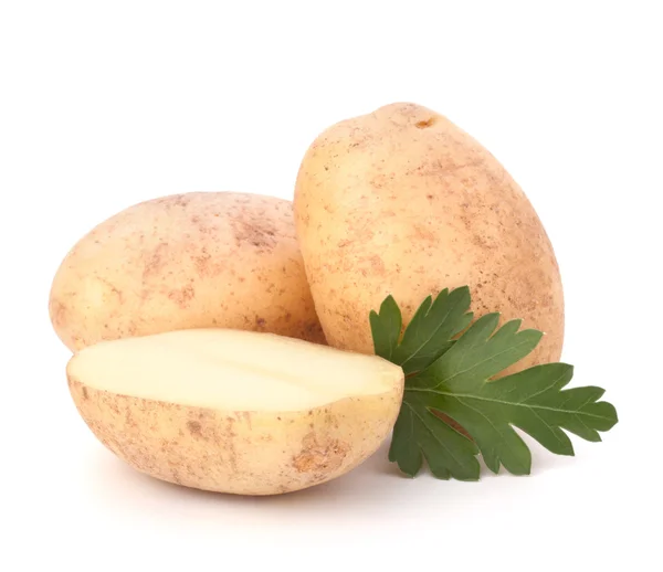 Aardappelknollen en peterselie bladeren — Stockfoto