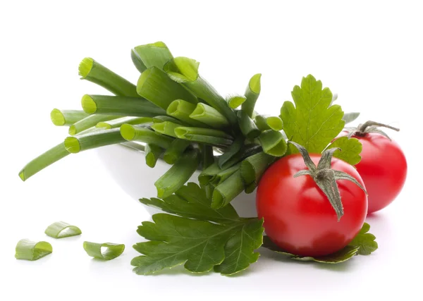 Spring onions and cherry tomato in bowl — Stock Photo, Image
