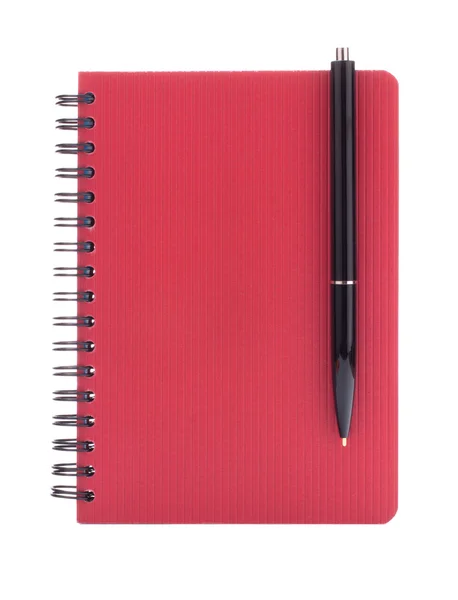 Красная тетрадь с ручкой — стоковое фото