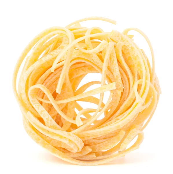 Italian pasta tagliatelle nest isolated on white background — Stock Photo, Image