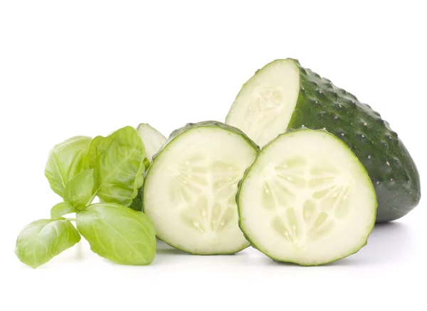 Sliced cucumber vegetable and basil leaves still life — Stock Photo, Image