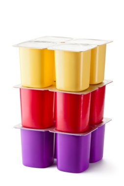 Assorted plastic containers for dairy products with foil lid clipart
