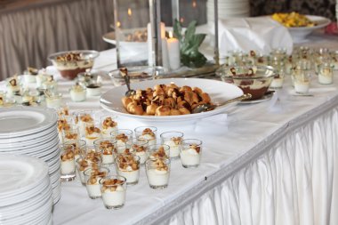 Dessert buffet at a catered event clipart