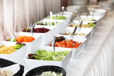 Buffet arrangement of fresh salads clipart