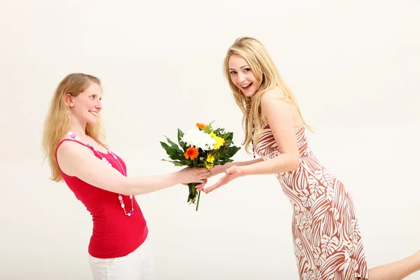 Vivacious woman receiving floral gift — Stock Photo, Image