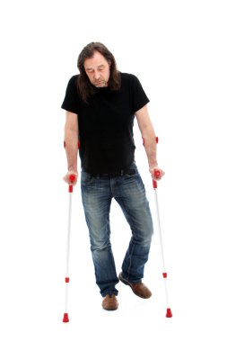Disabled man walking on crutches clipart