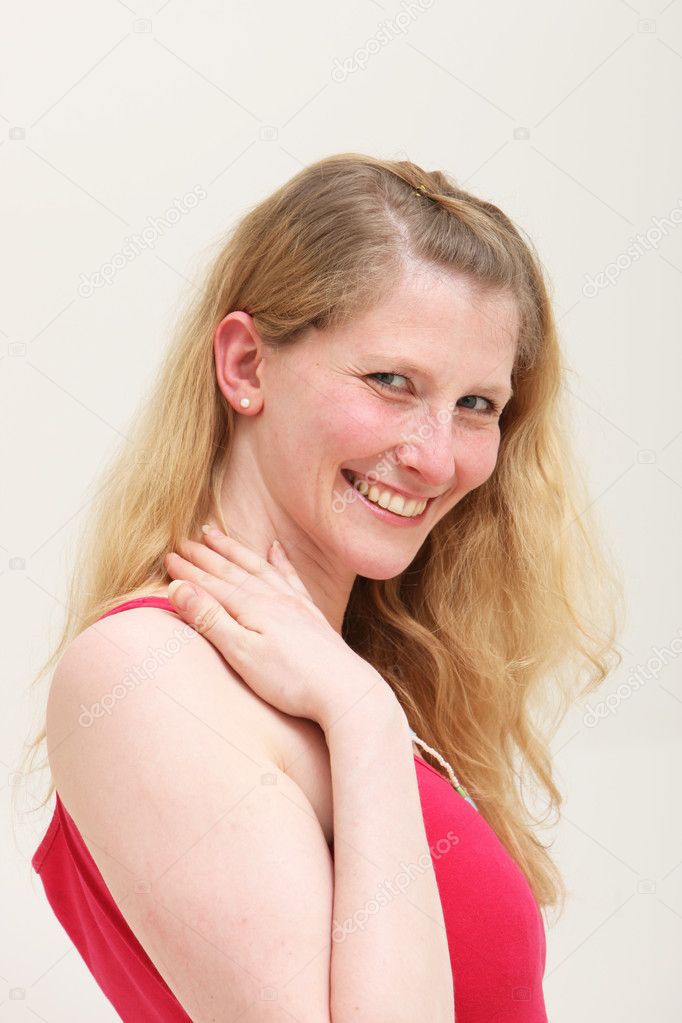 Elated woman smiling in pleasure