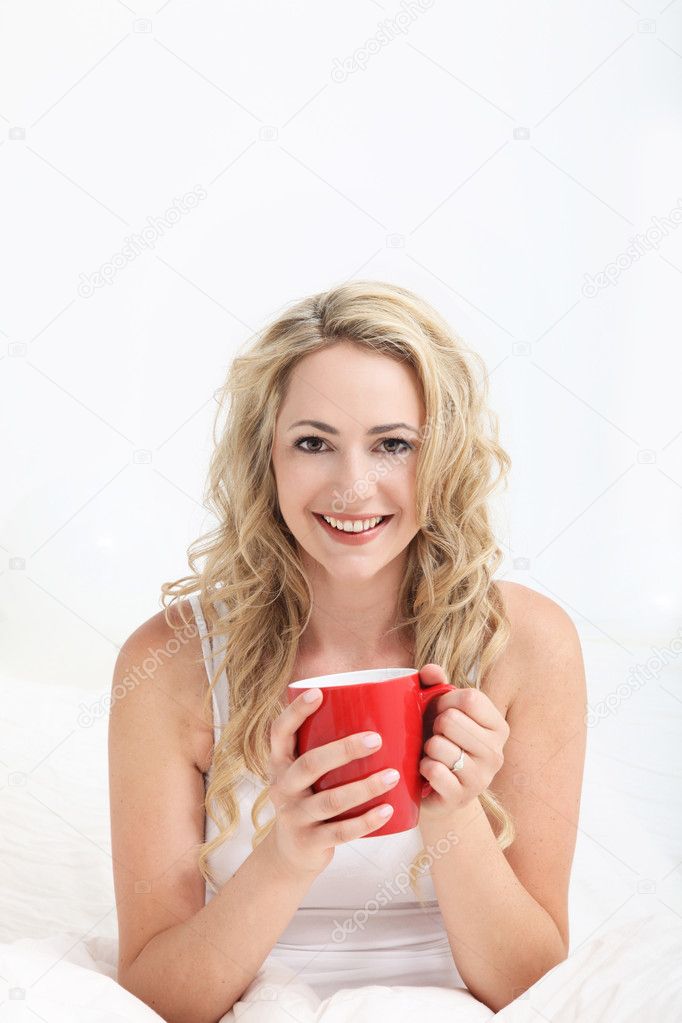 Enjoying a mug of coffee in bed