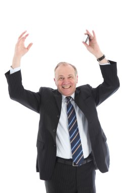 Jubilant businessman with arms raised clipart