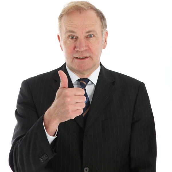 Elderly businessman giving thumbs up — Stock Photo, Image