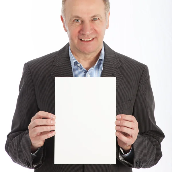 Hombre de negocios con tarjeta blanca en blanco — Foto de Stock