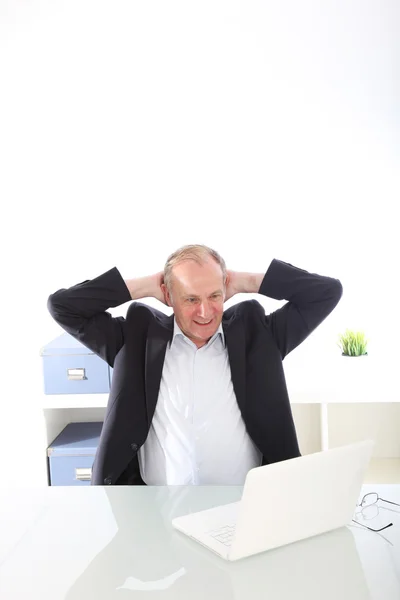 Satisfied businessman with raised arms — Stock Photo, Image