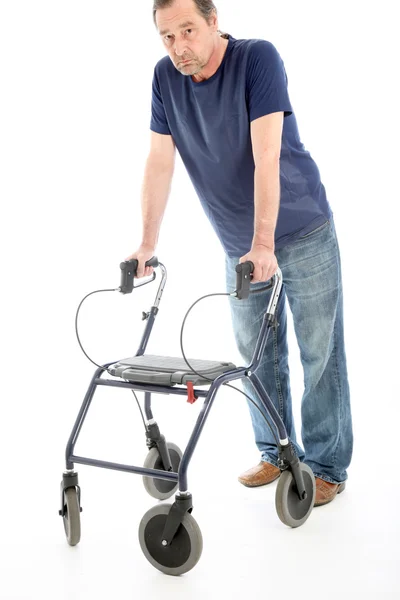 Despondent man leaning on medical walker — Stock Photo, Image