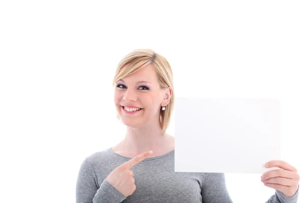 Mulher sorridente apontando para sinal em branco — Fotografia de Stock