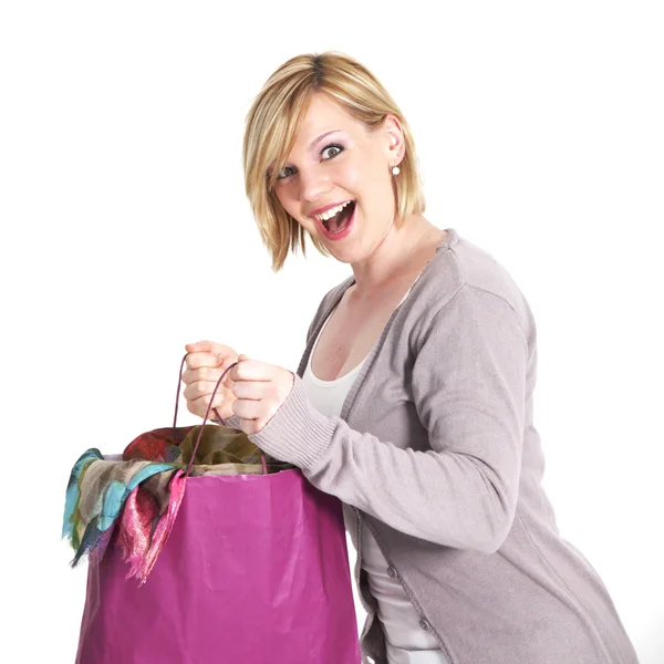 Ecstatic shopaholic with full carrier bag — Stock Photo, Image