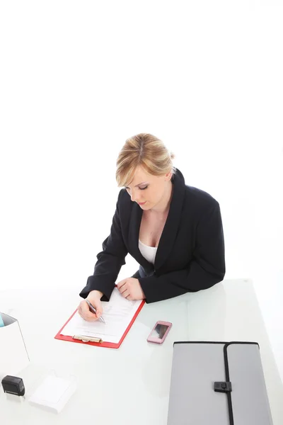 Businesswoman working at her desk — Stock Photo, Image