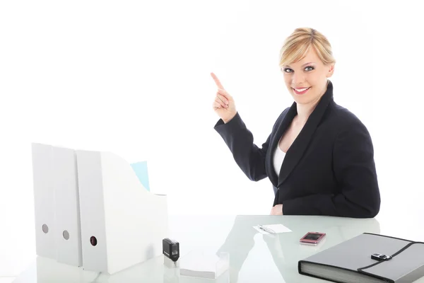 Businesswoman pointing to blank copy space Royalty Free Stock Images