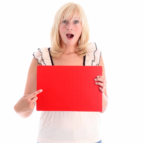 Excited woman pointing to red sign — Stock Photo, Image