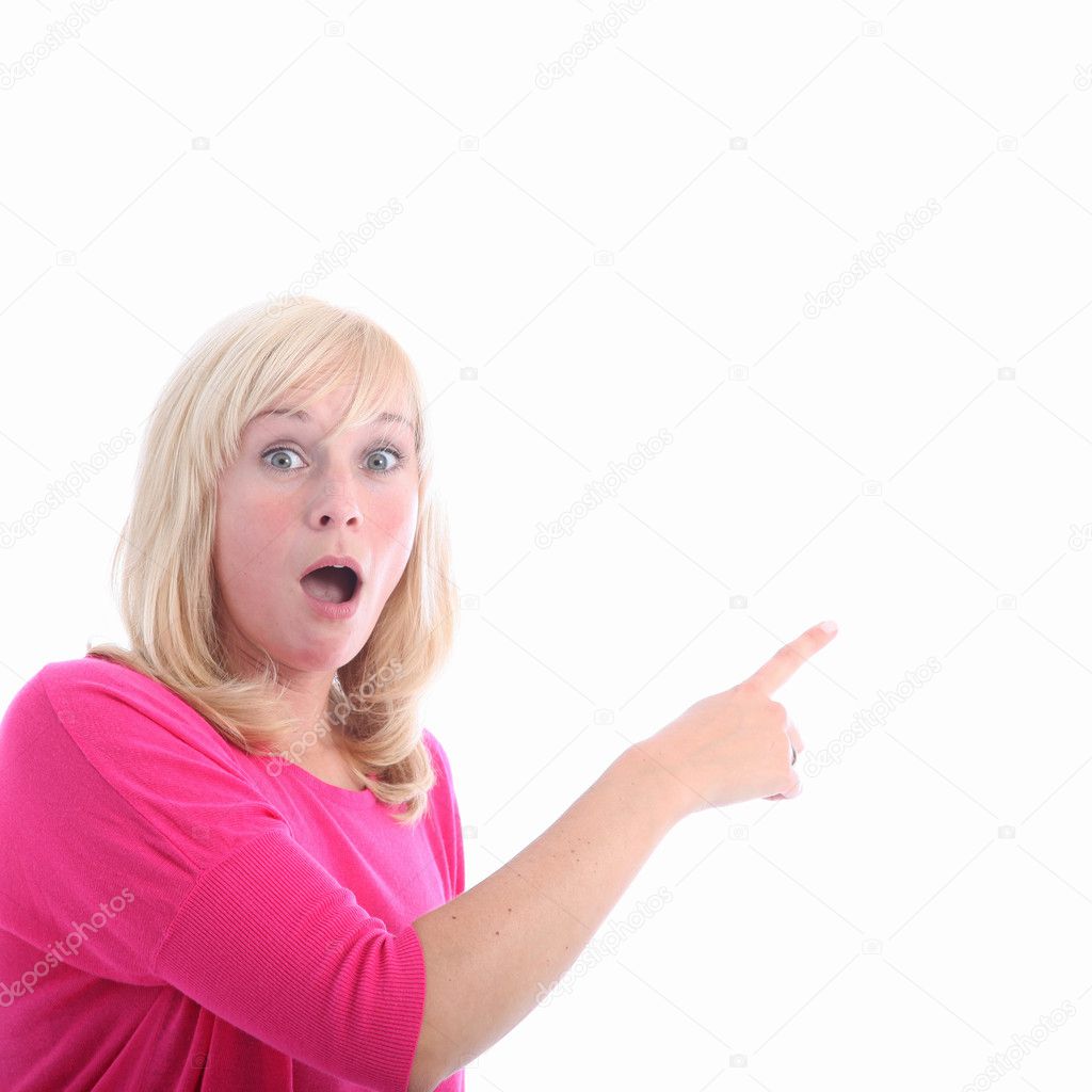 Awestruck woman pointing to blank copyspace