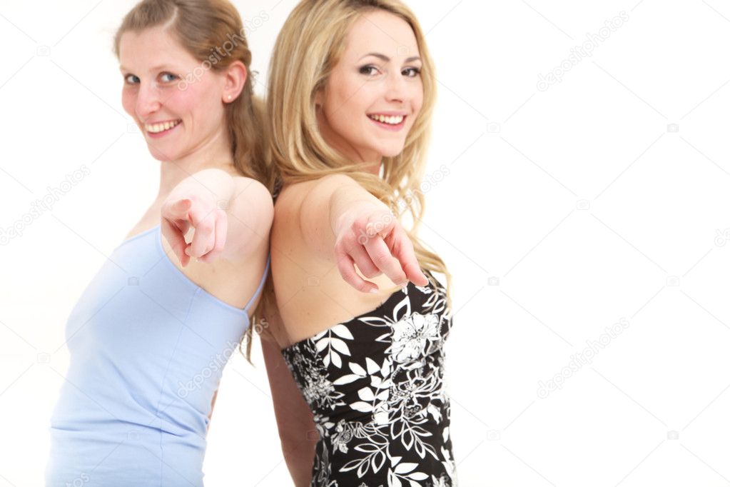 Ladies having fun pointing to camera
