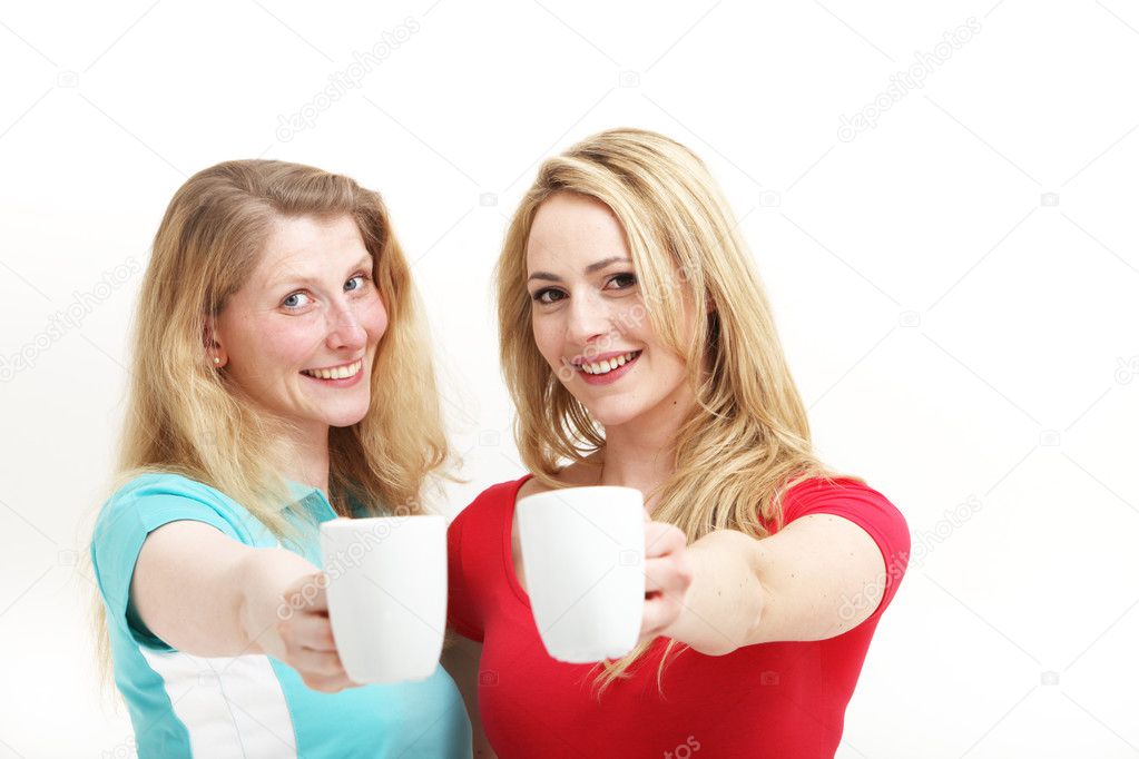 Happy women toasting with coffee