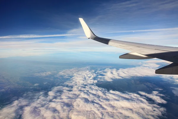 stock image Airplain over clouds.