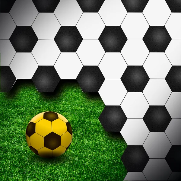 緑の芝生の創造的な背景としてサッカー ボール — ストック写真