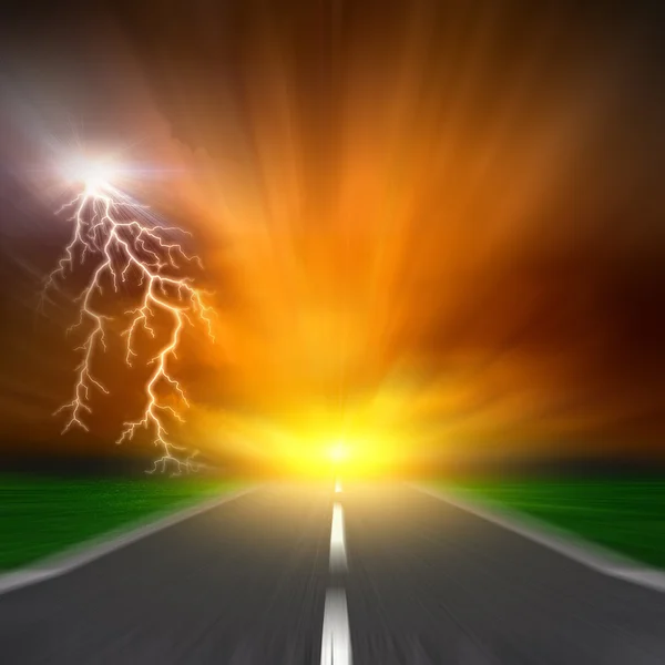 The blurred asphalt road with storm lightning on sky — Stock Photo, Image