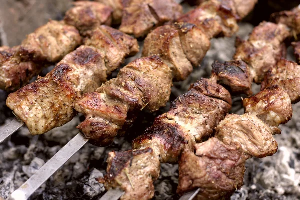 stock image Insanely delicious kebab prepares on the fire outdoors