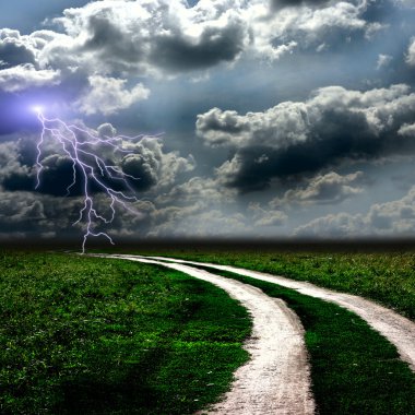 The road through meadow and the stormy sky clipart