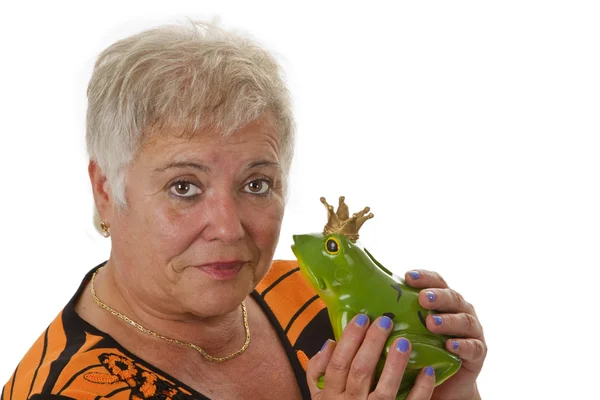 Starszy kobieta z zabawkami żabę książę — Zdjęcie stockowe