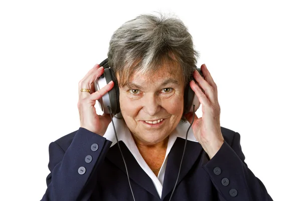 Vrouwelijke senior met hoofdtelefoon — Stockfoto
