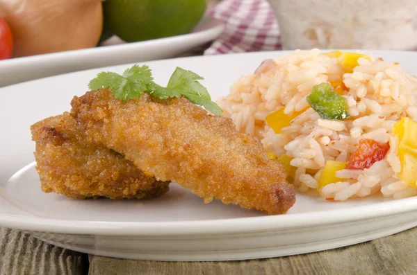 Chicken nuggets with rice salad — Stock Photo, Image