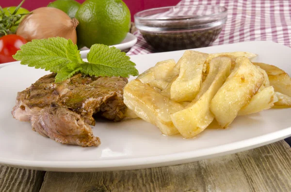Lamb steak with french fries — Stock Photo, Image