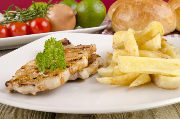 Pork chops with french fries — Stock Photo, Image