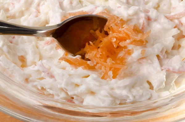 Put some grated carrot on to a coleslaw salad — Stock Photo, Image