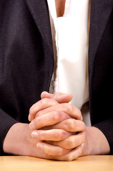 Woman holding hands folded for prayer — Stock Photo, Image