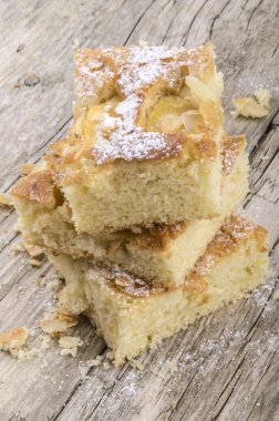 Freshly baked apple cake with almond flakes clipart