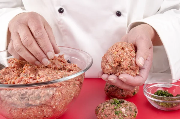 Female chef making meat balls — Stock Photo, Image