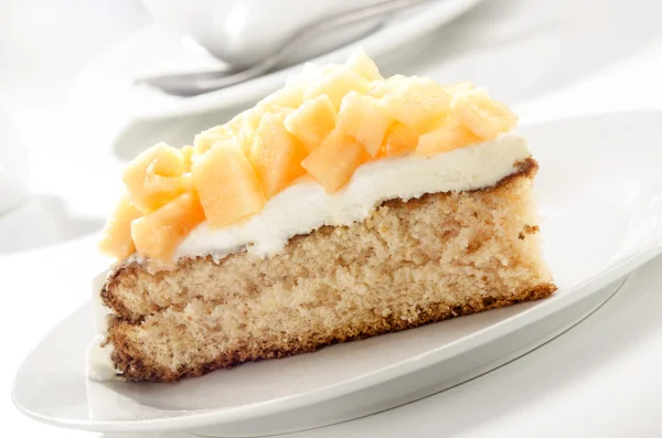 Summer cake with diced honey melon — Stock Photo, Image